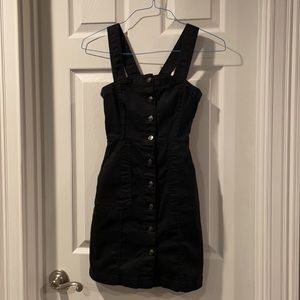 Stretch black denim dress, metal button front